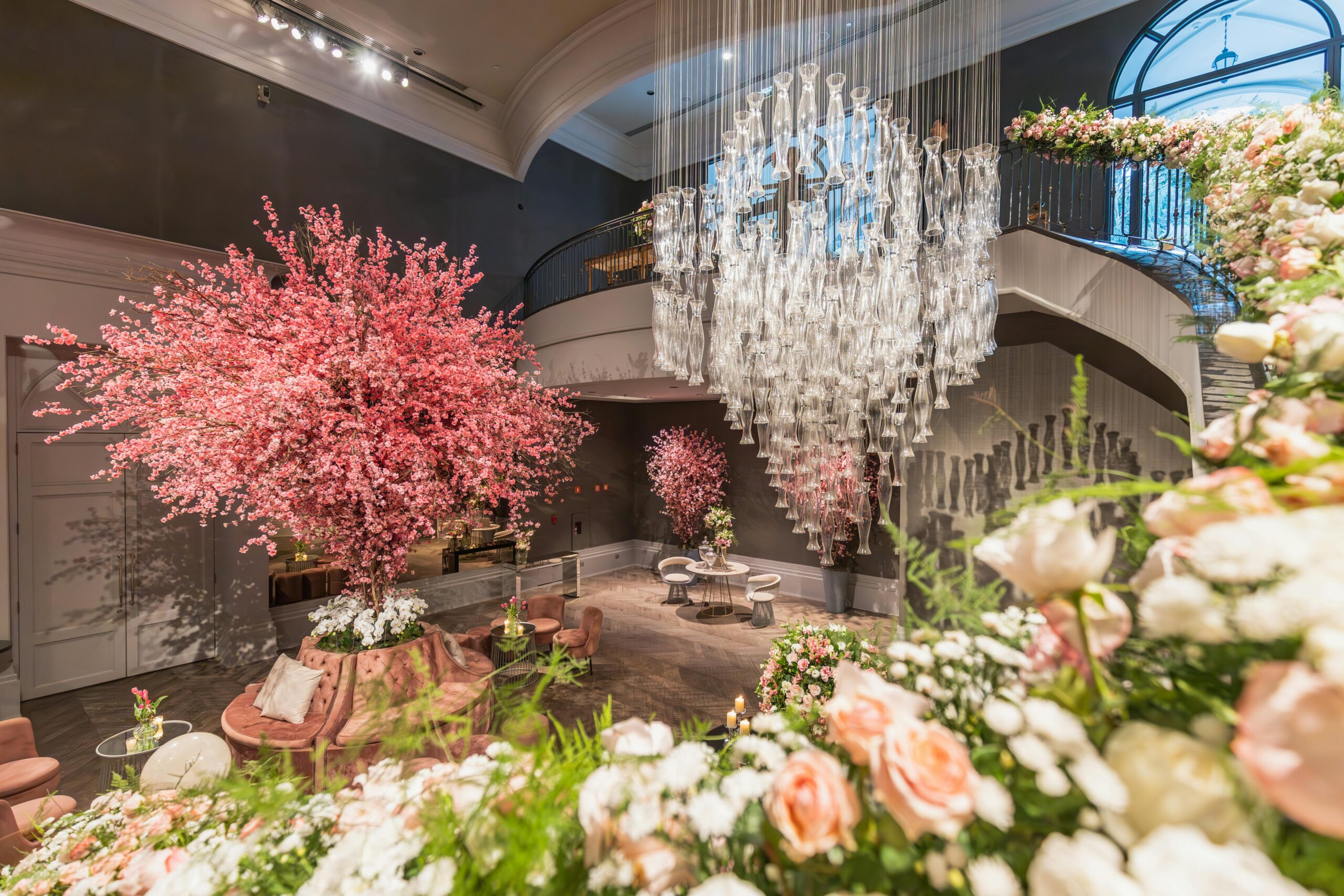 Lavish interior featuring elegant floral arrangements and a stunning glass chandelier.